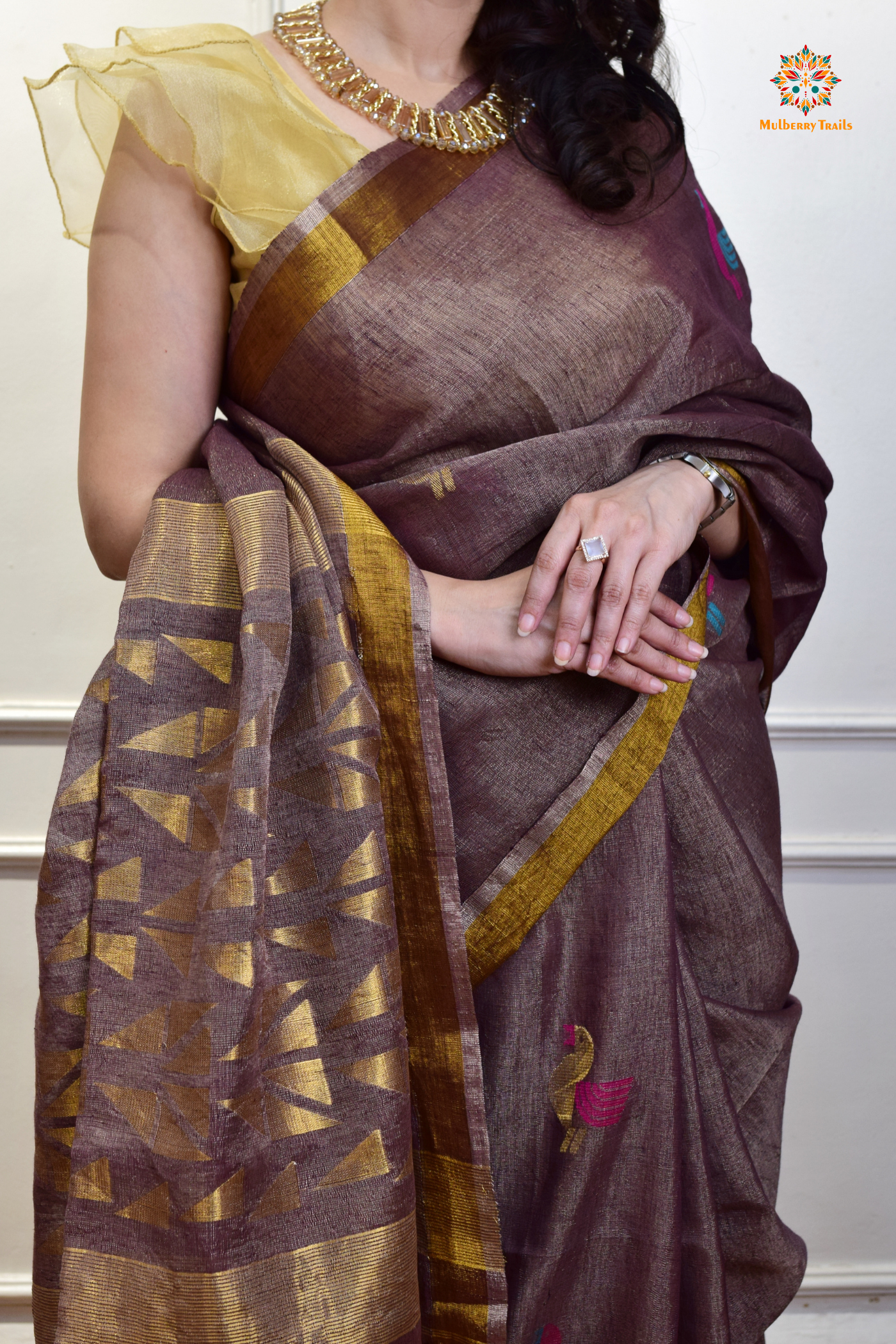 This image features an Elegant tissue saree featuring intricate handwoven Jamdani lotus motifs, with a lightweight, shimmery fabric that drapes beautifully, perfect for festive and special occasions. Party wear , diwali theme. 