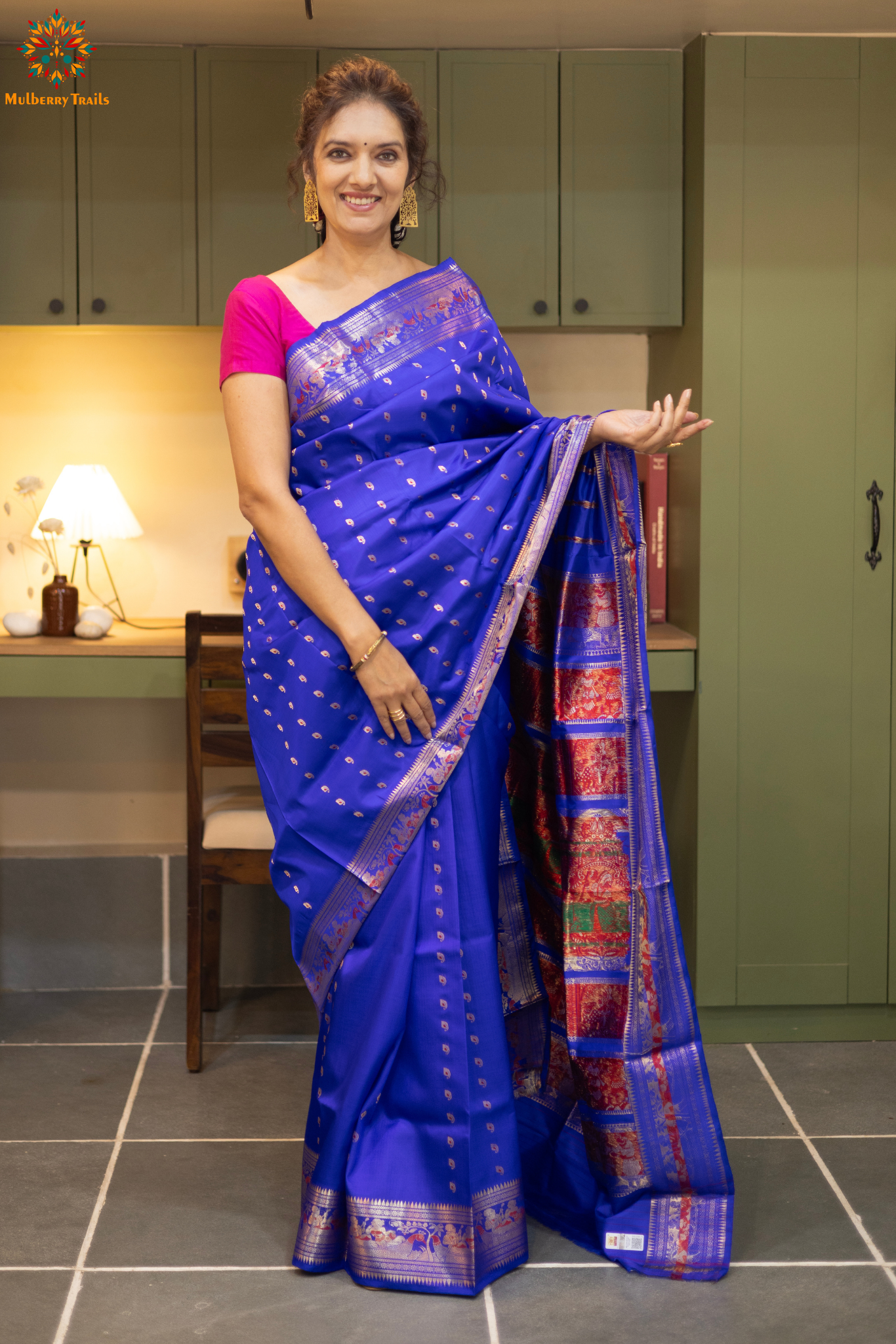 Swarnachari – Pure Silk Hazarbutta Saree

1. “Pure silk Swarnachari saree with hazarbutta thousand-motif weave and copper zari detailing for a regal look.”

2. “Silk Mark pure silk hazarbutta saree featuring intricate copper zari motifs and rich texture.” 
Woman wearing a black and copper zari saree in a room with a desk and lamp.