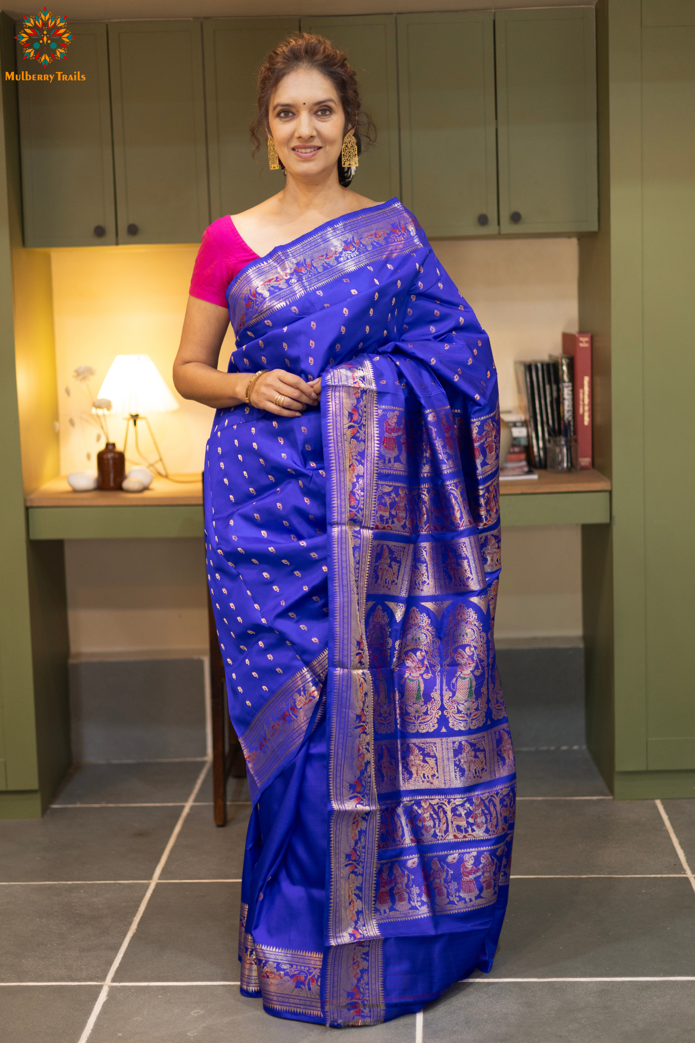 Swarnachari – Pure Silk Hazarbutta Saree

1. “Pure silk Swarnachari saree with hazarbutta thousand-motif weave and copper zari detailing for a regal look.”

2. “Silk Mark pure silk hazarbutta saree featuring intricate copper zari motifs and rich texture.” 
Woman wearing a black and copper zari saree in a room with a desk and lamp.