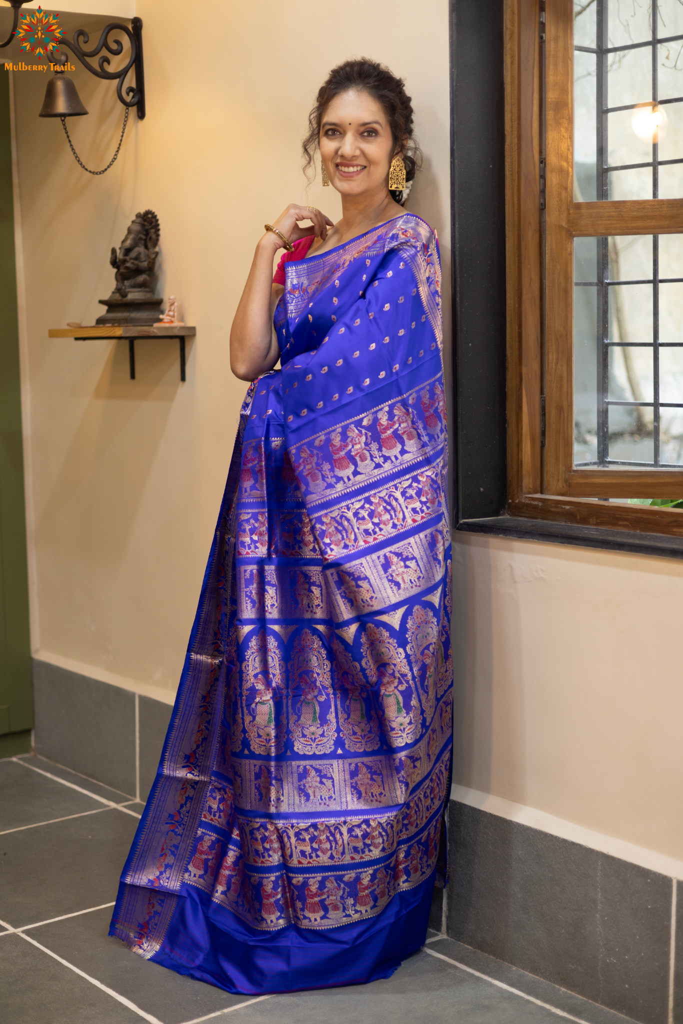 Swarnachari – Pure Silk Hazarbutta Saree

1. “Pure silk Swarnachari saree with hazarbutta thousand-motif weave and copper zari detailing for a regal look.”

2. “Silk Mark pure silk hazarbutta saree featuring intricate copper zari motifs and rich texture.” 
Woman wearing a black and copper zari saree in a room with a desk and lamp.