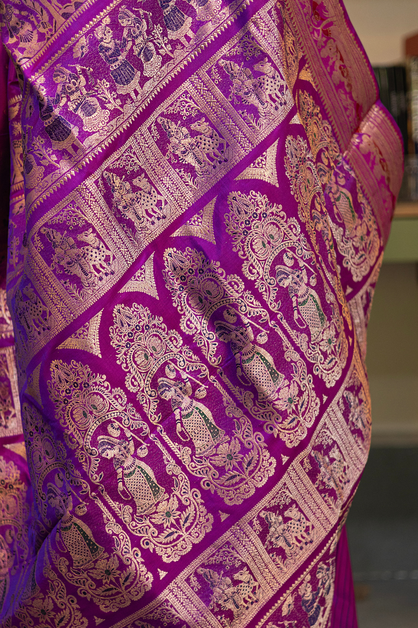 Woman wearing a purple saree with a pattern in a room. Woman in a pink saree standing in a elegant setting. 
Swarnachari – Pure Silk Hazarbutta Saree

1. “Pure silk Swarnachari saree with hazarbutta thousand-motif weave and copper zari detailing for a regal look.”

2. “Silk Mark pure silk hazarbutta saree featuring intricate copper zari motifs and rich texture.” 
Woman wearing a black and copper zari saree in a room with a desk and lamp.