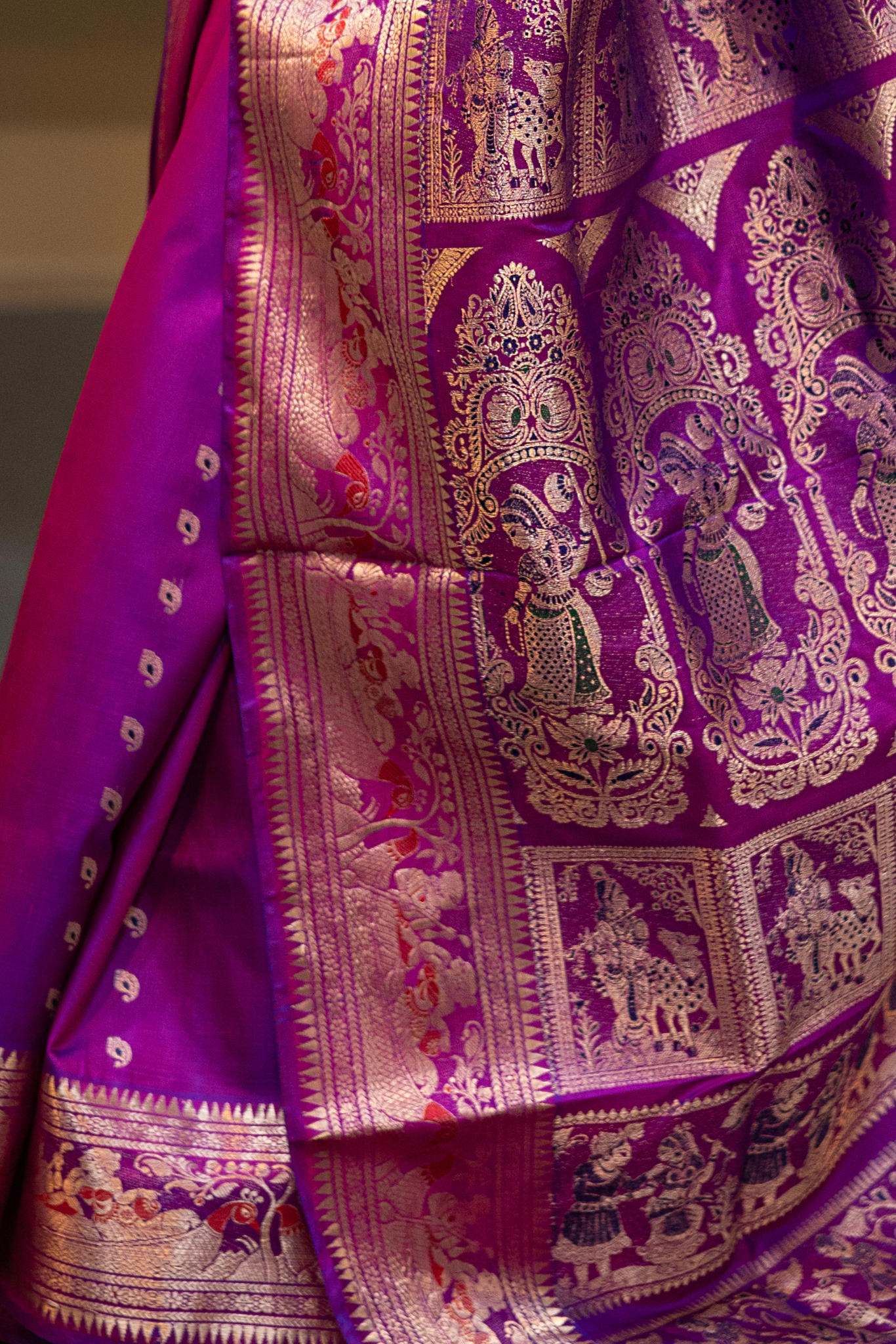 Woman wearing a purple saree with a pattern in a room. Woman in a pink saree standing in a elegant setting. 
Swarnachari – Pure Silk Hazarbutta Saree

1. “Pure silk Swarnachari saree with hazarbutta thousand-motif weave and copper zari detailing for a regal look.”

2. “Silk Mark pure silk hazarbutta saree featuring intricate copper zari motifs and rich texture.” 
Woman wearing a black and copper zari saree in a room with a desk and lamp.